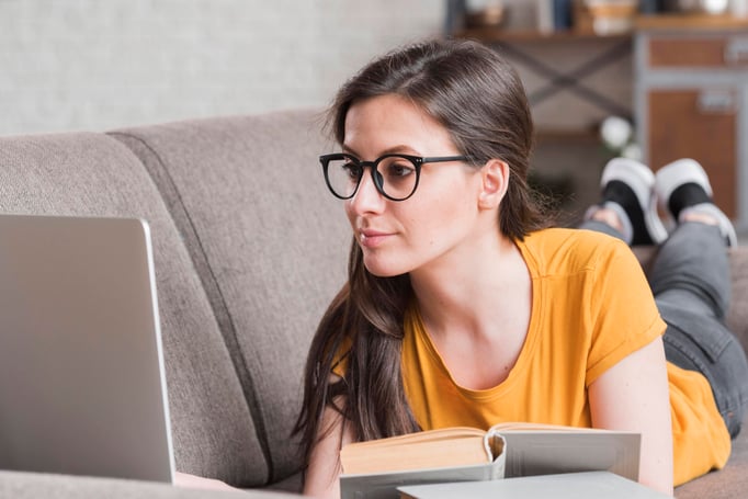 smart-young-student-with-laptop-books